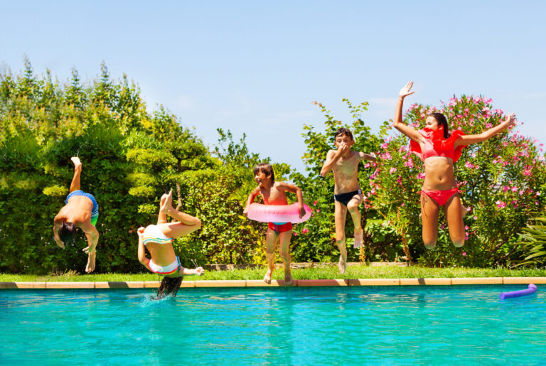 kids-jumping-into-backyard-pool