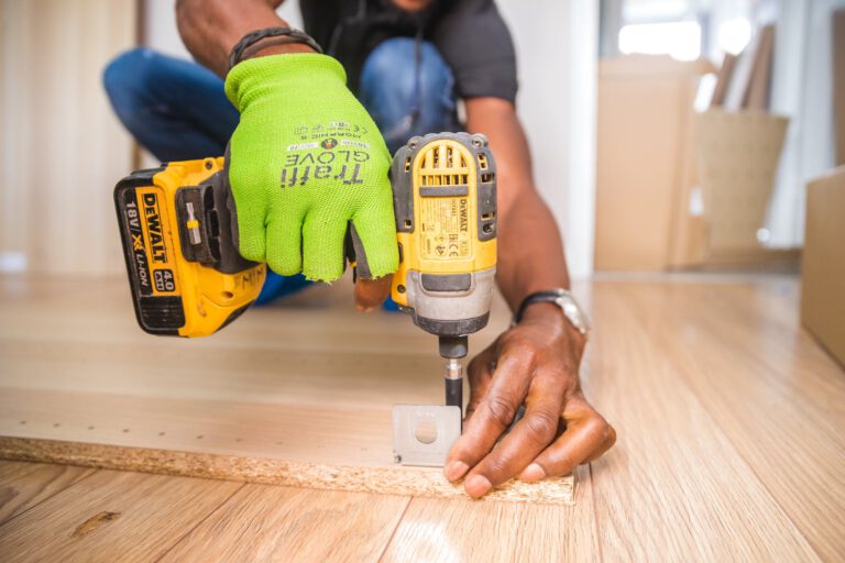 person using dewalt cordless impact driver for home improvement project