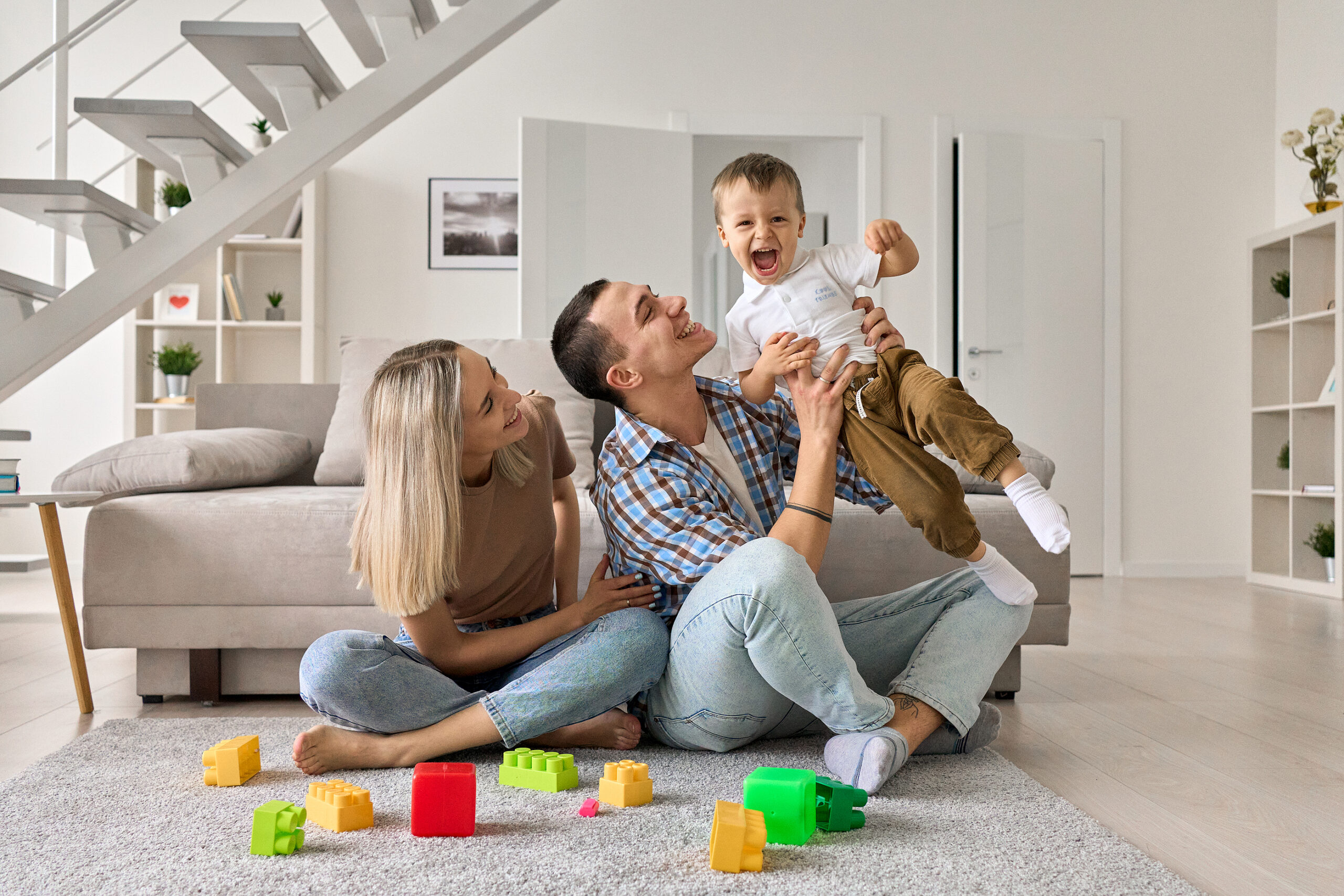 young-happy-family-playing-with-son