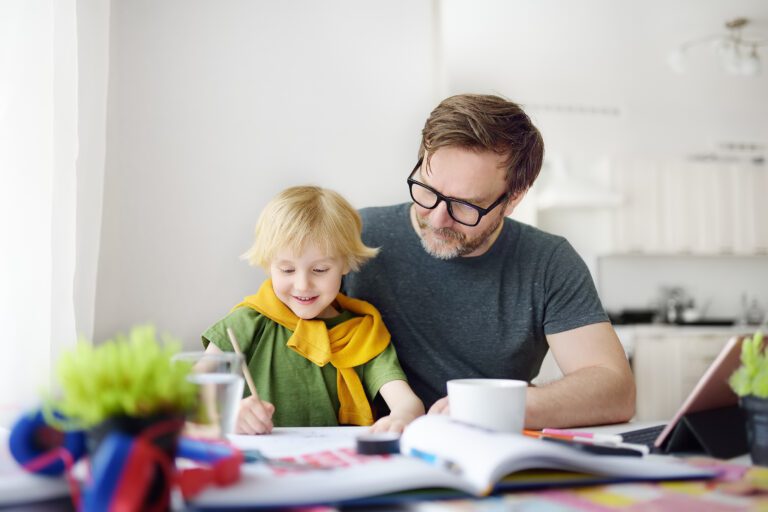 Father Helping Child Do Homework At Home. Homeschooling, Distanc